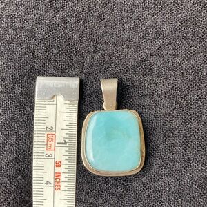 Silver and blue stone pendant